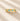 Gold ring with blue gemstones on a beige background