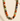 Multicolored beaded necklace on a textured beige surface