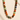 Multicolored beaded necklace on a textured beige surface