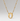 A gold necklace featuring a beaded chain and an oval pendant with a cutout design of the miracoulous virgen, shown against a neutral light gray background.